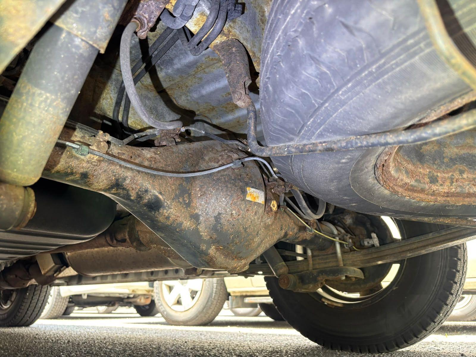 Inspector photo — rusted rear axle